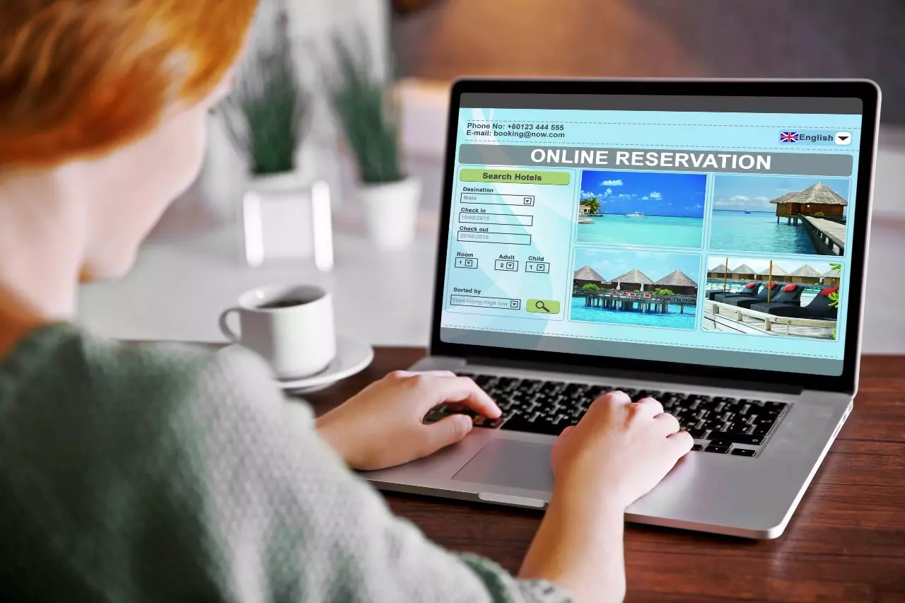 Individual booking hotel reservation on laptop